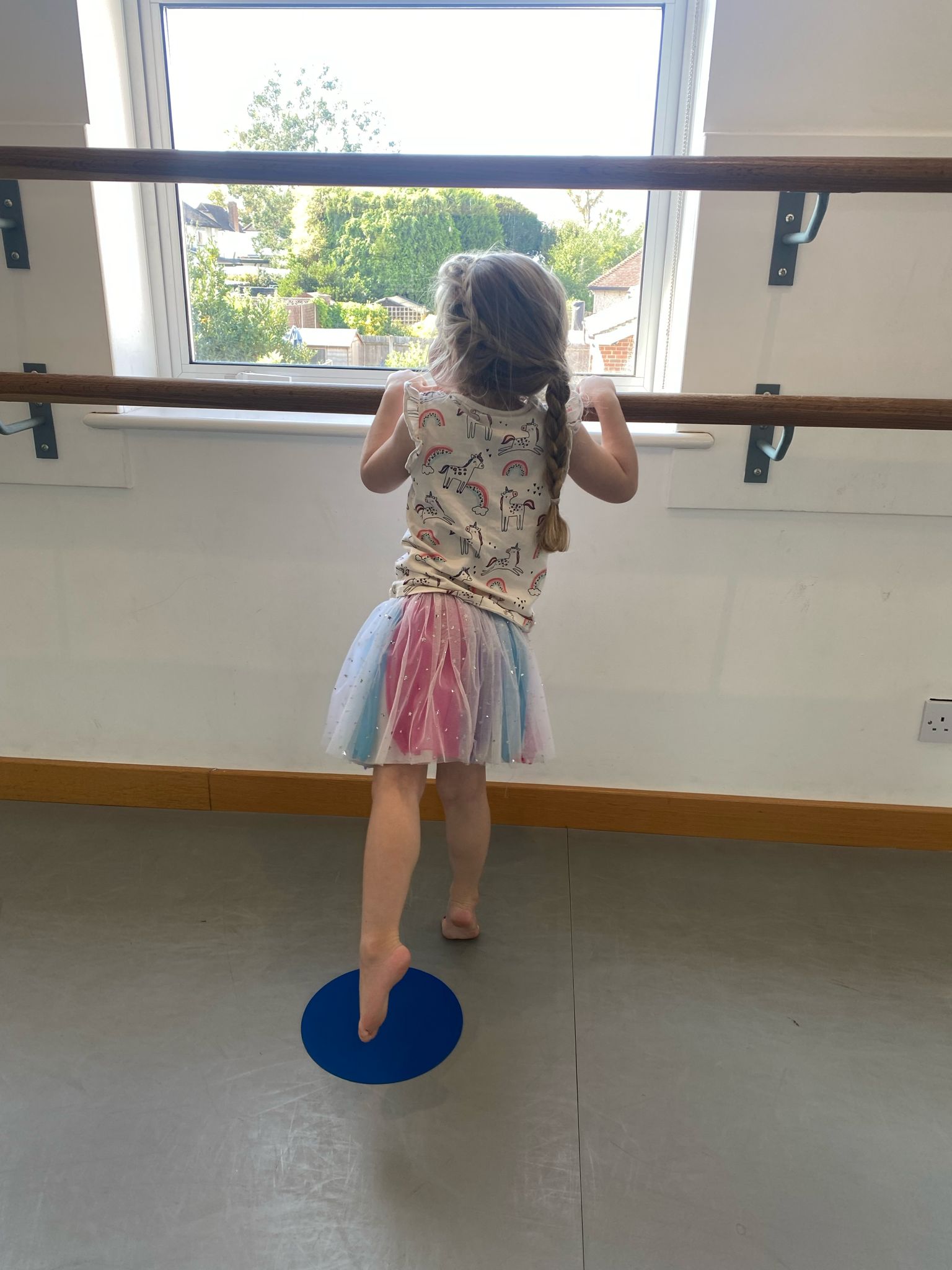 Child practising at the barre