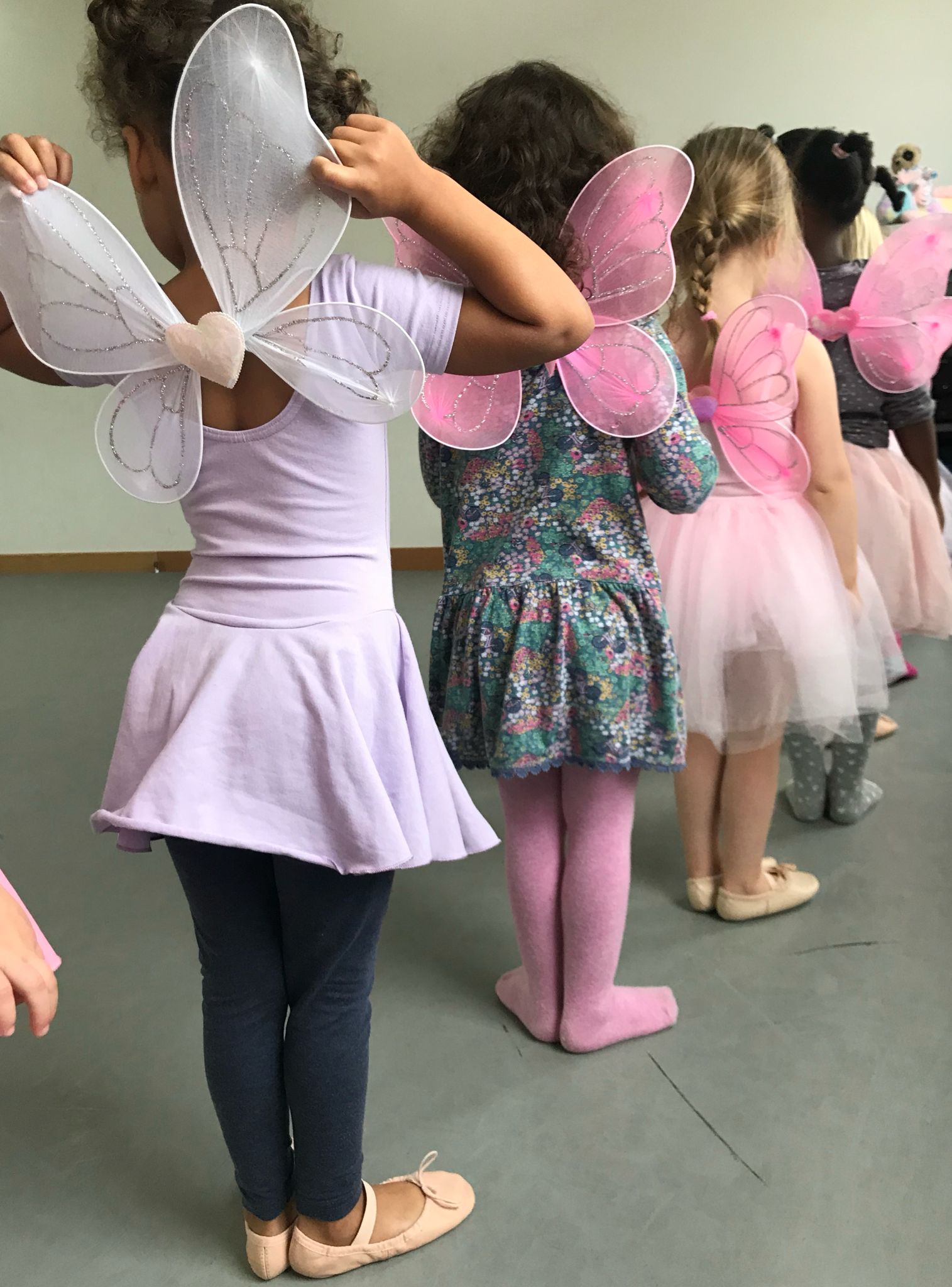 Children dancing with fairy wings