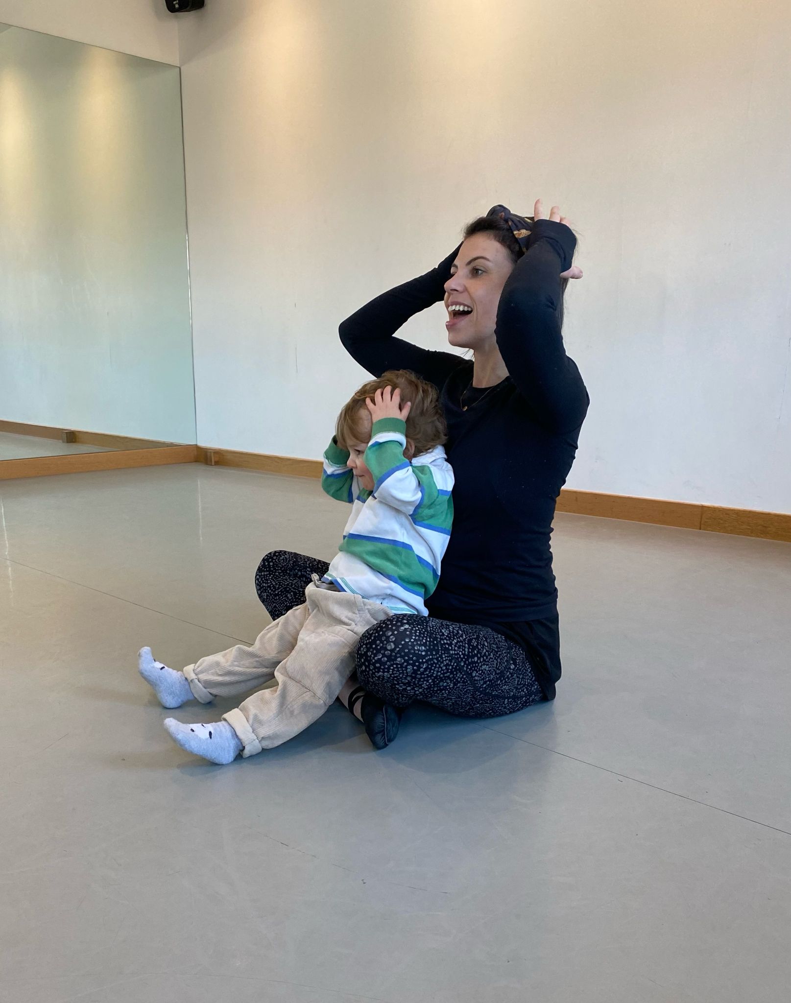 Teacher guiding a child through movement